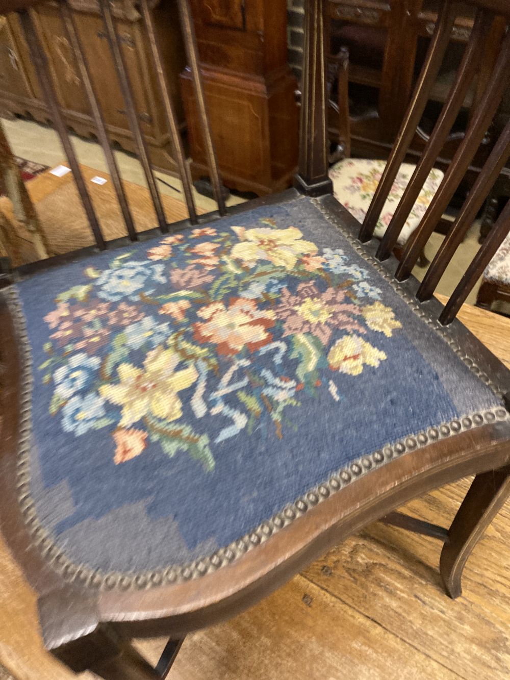 A Victorian inlaid mahogany corner elbow chair